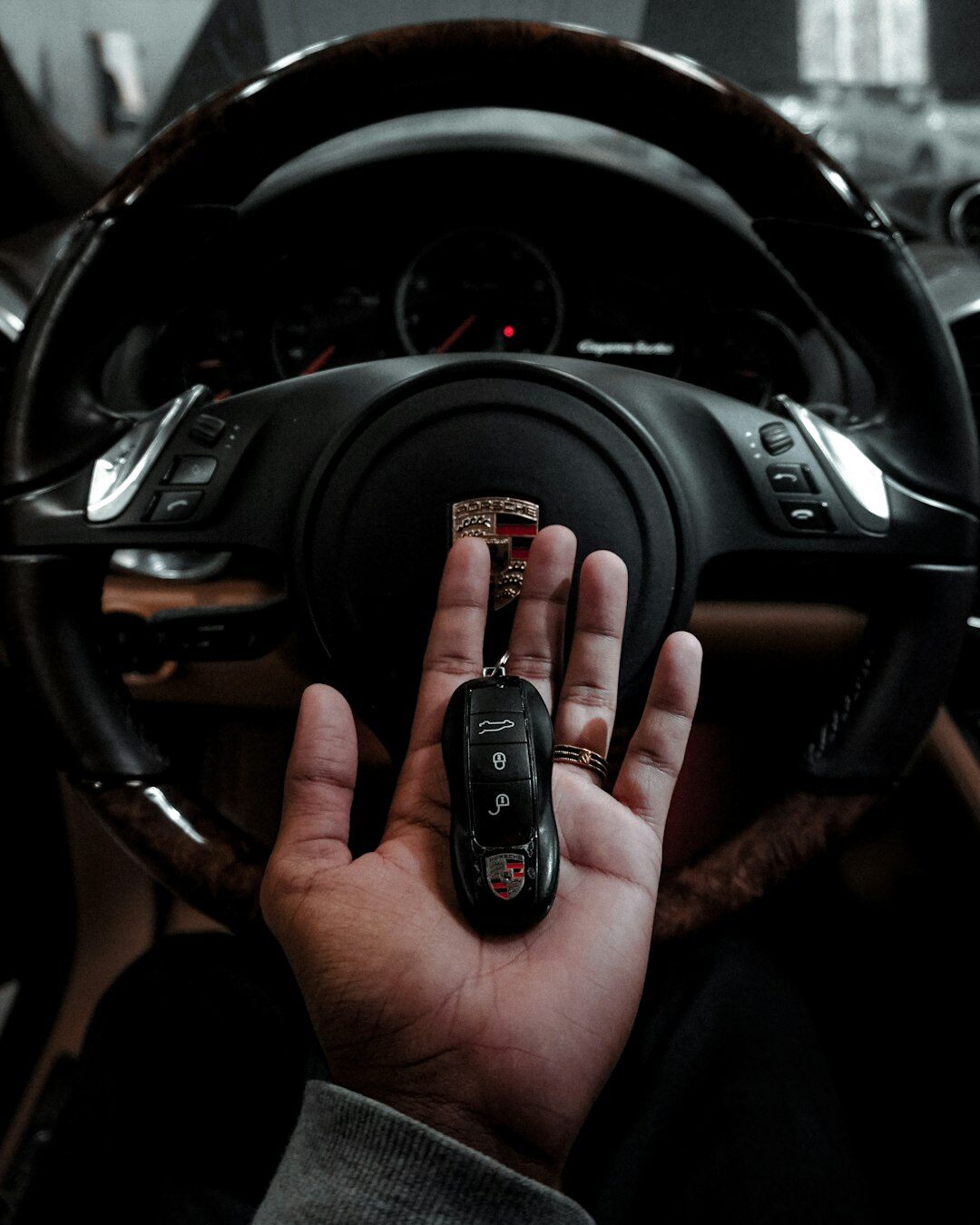 Uruguayan man handing over car keys outside a dealership
