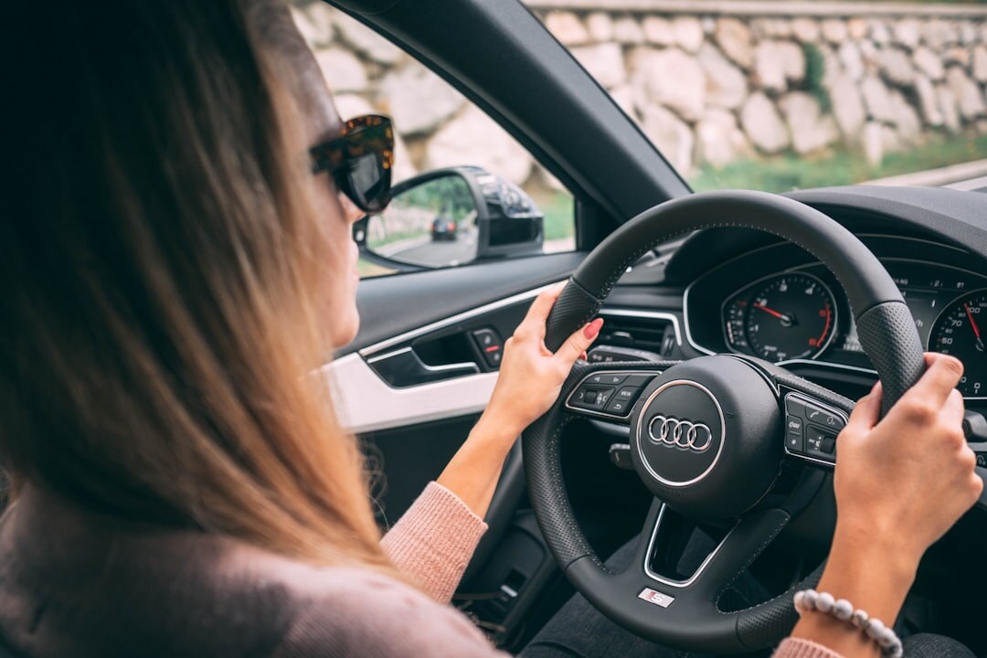 person test driving luxury car